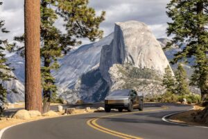 cybertruck driving through the mountains